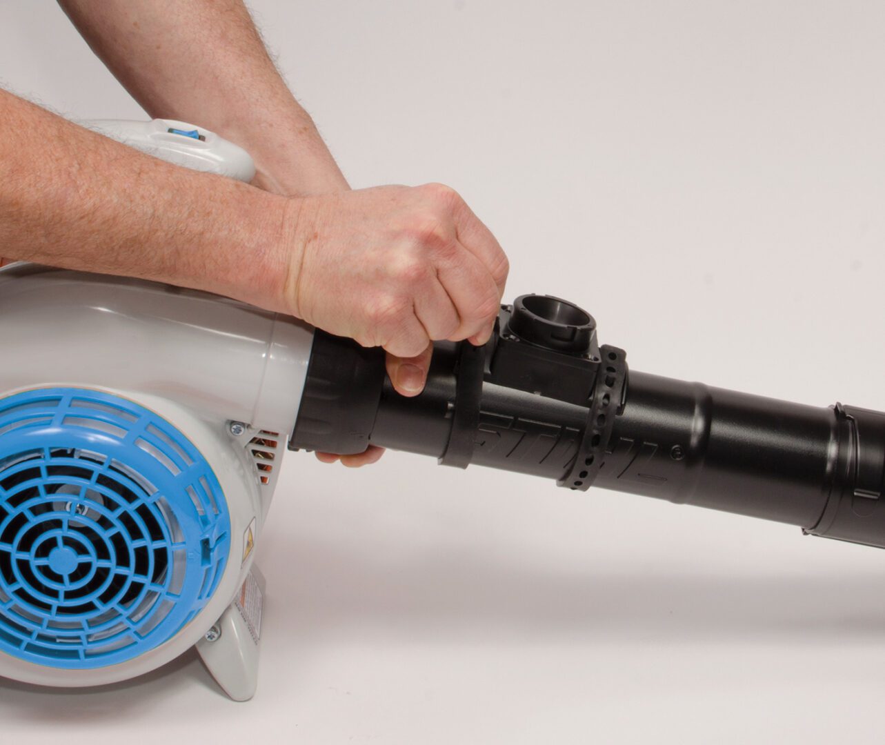 Securing the mounting straps on the blower tube