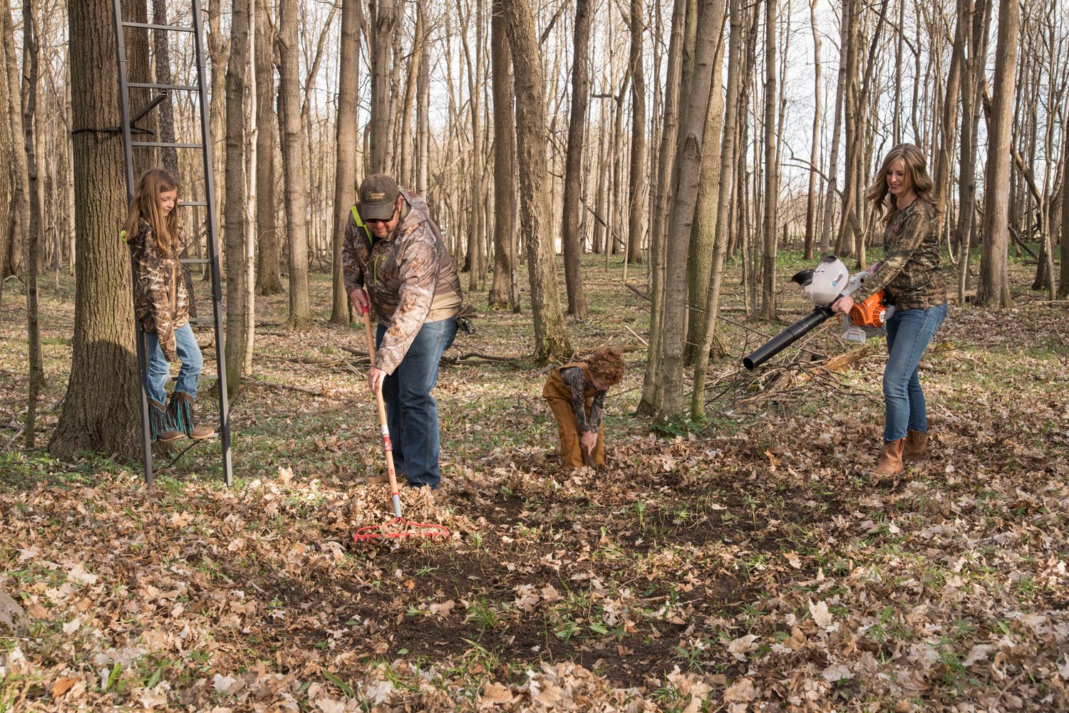 Family preparing a hunting food plot with the Extreme Blower Spreader
